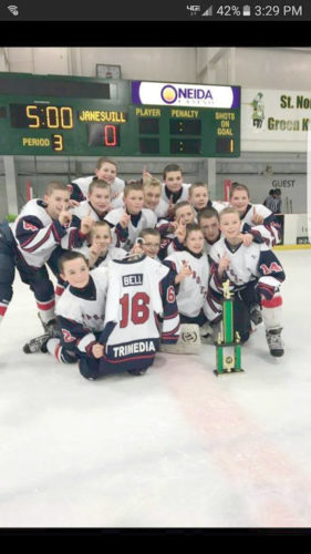 Team members of the Marquette Tri Media 12-under Pee Wee AA hockey team pose with the trophy after winning the Green Bay, Wis., Tundra Tussle tournament recently. They include Drew Dellies, Jack Sides, Ethan Phillips, Aj Bottari, Theo Adams, Brayden Grange, Cole Ranta, Caden Bouws, Jake Garrow, Owen Riipi, Colin Nemacheck, Dylan King, Joe De Mattia, Jack Helgren and Liam Beerman. Not in the photo is Caleb Bell. (Submitted photo)